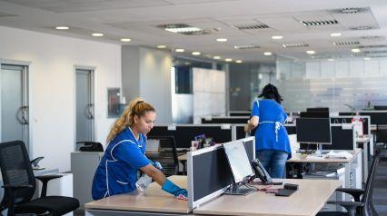 Employees are ensuring the office is clean while utilizing a checklist