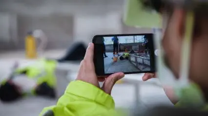 man taking a photo of an incident with his phone for his osha form 301|OSHA Form 301|OSHA Form 301 Sample Report