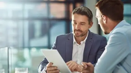 a financial analyst talking to a company representative to evaluate a company's financial health using a financial due diligence checklist