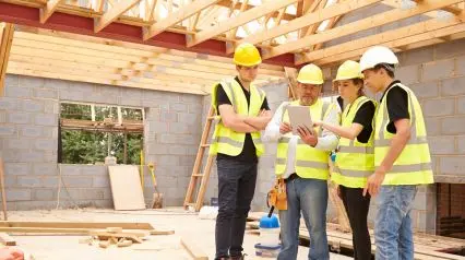 construction builders conducting health and safety training on site