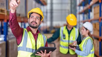 supply chain management stakeholders conducting site inspections using tablet