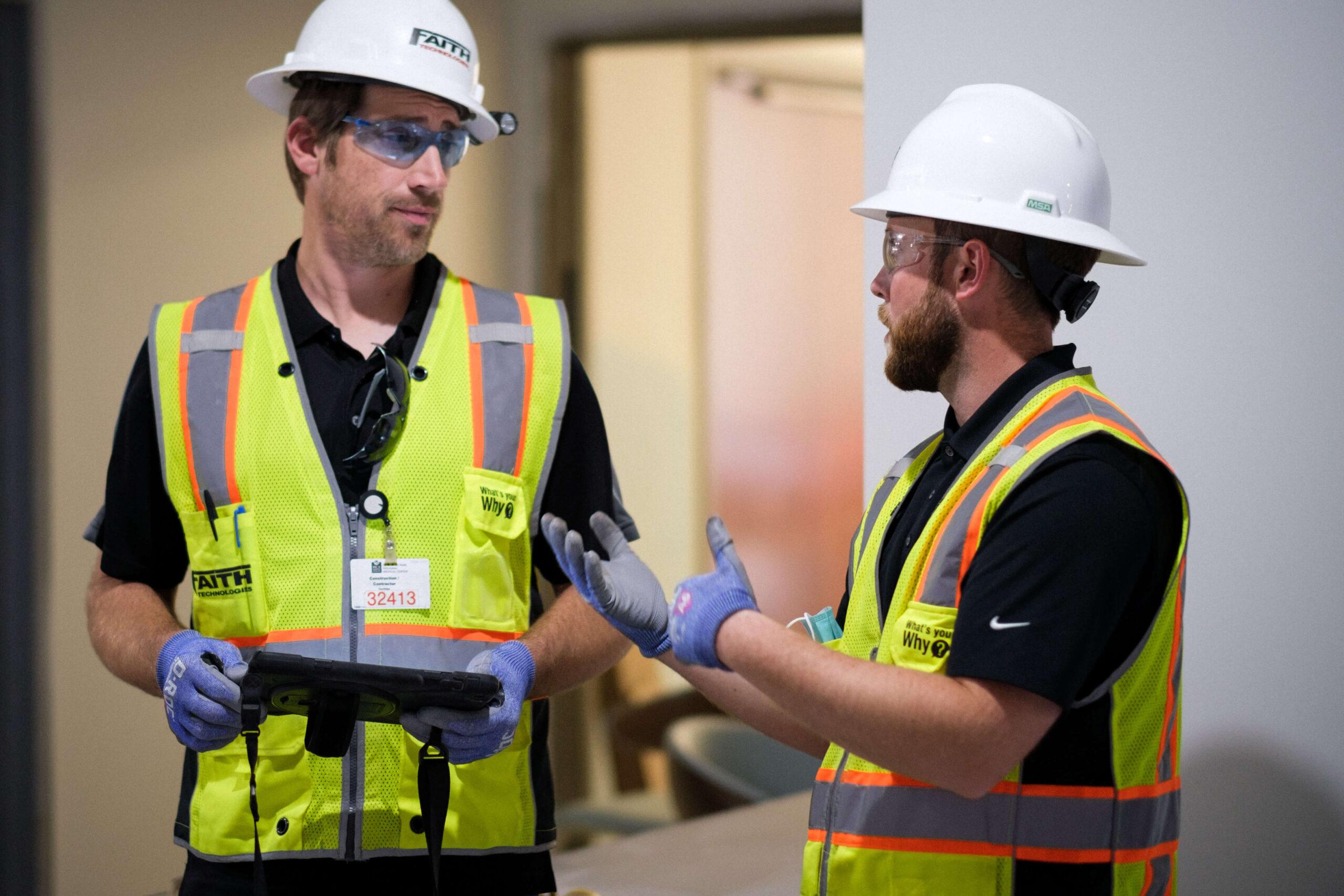 workers using an enterprise management solution on the field