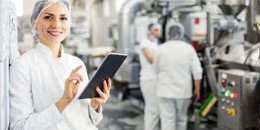 worker in a food factory using a food safety culture questionnaire