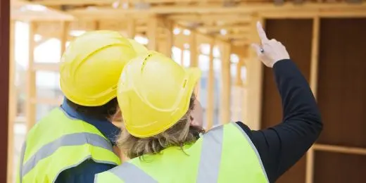 two construction workers having a construction safety training session