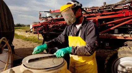 farmer following farm safety tips