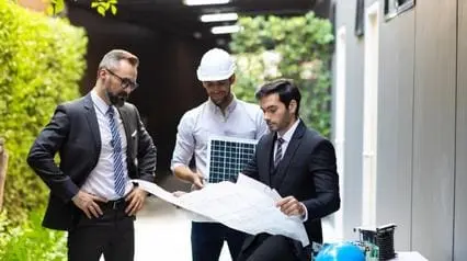 construction team discuss green building design plan