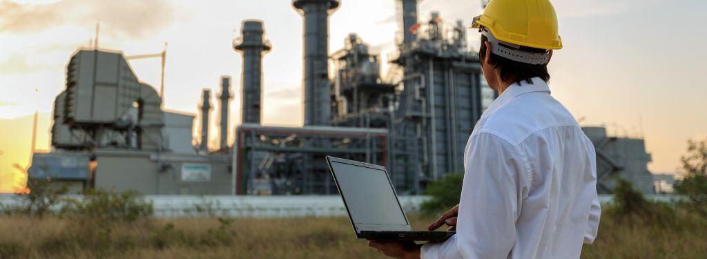 employee using a fuel management system on their laptop