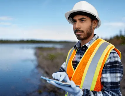 Marine biologist analysing water test results on a tablet