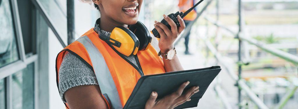 worker using a job hazard analysis software on their tablet on-site