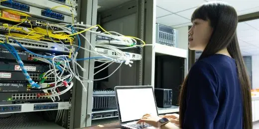 worker dealing with the 3g shutdown in the computer room