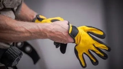 worker with hand gloves for hand safety