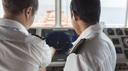 Officers at the bridge navigating the vessel