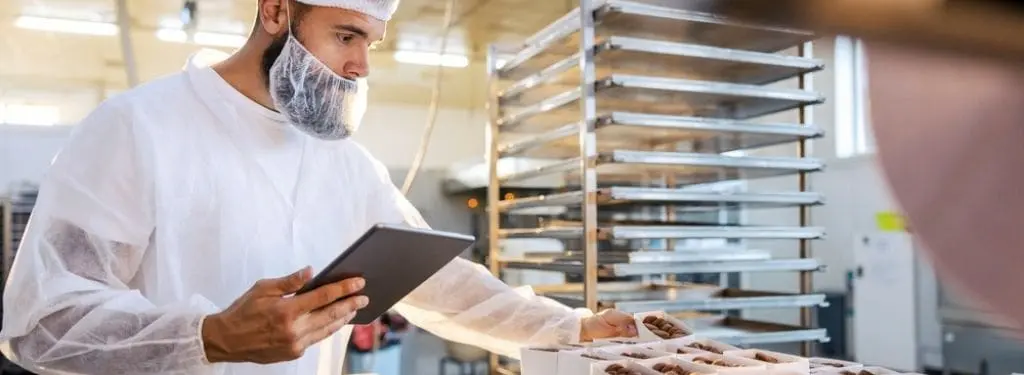 An employee performing food safety checks using SafetyCulture App