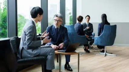 a group of businessmen conducting a legal due diligence check with a checklist